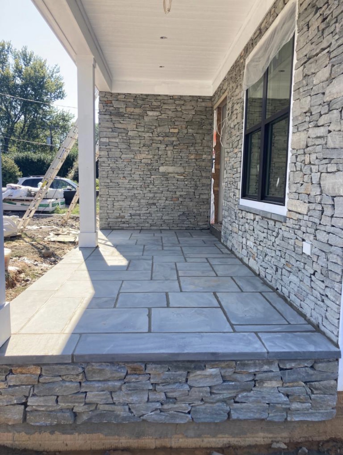 Finished stone porch and flagstone floor